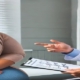 An image of a doctor discussing Ozempic vs Wegovy with his overweight female patient in a clinical setting. management.