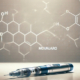 Mounjaro Tirzepatide side effects – A Mounjaro injection pen lies on a reflective surface, with a chemical structure diagram in the background, symbolizing its scientific formulation and effects.